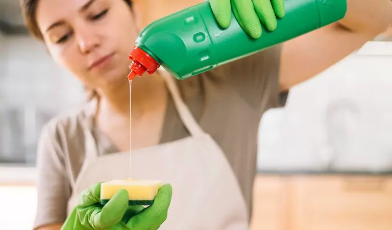 woman with mineral oil ready to clean