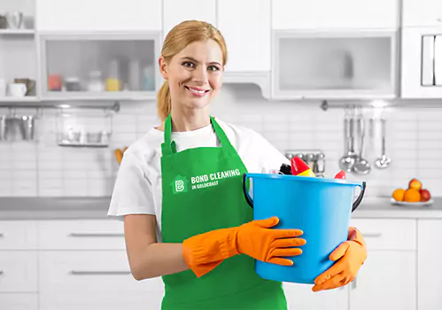 Professional cleaner ready with cleaning tools