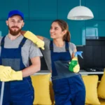 Smiling man and young woman as a professional cleaners