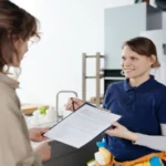 Housewife concluding a deal with cleaning service worker