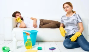 Young couple at home near sofa washing supplies cleaning lifestyle high quality photo