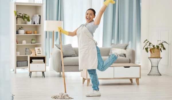 Fun asian woman mop or cleaning living room with housekeeping floor product for home cleaning