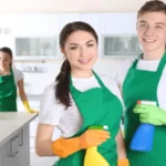 Cleaning service team working in the home kitchen