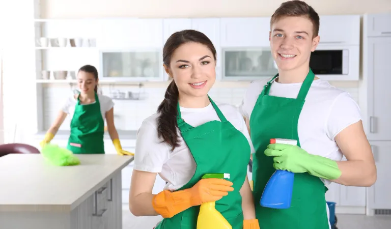 Cleaning service team working in the home kitchen
